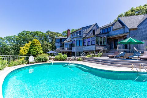 Pool and water view side of house